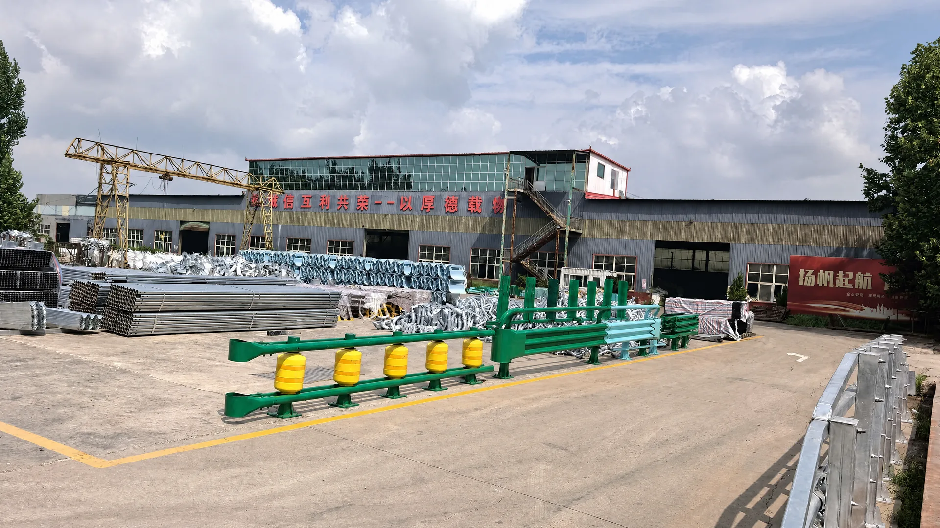 Tianshun factory exterior with guardrail and rolling barrier products in the yard